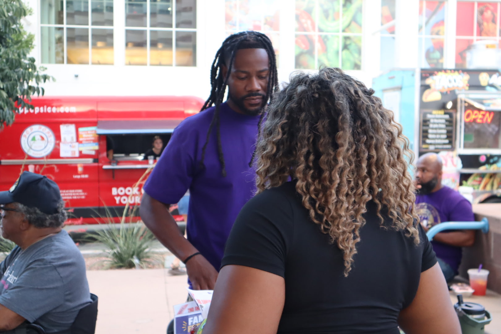 Four kids at an education advancement booth